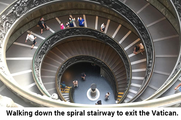 Walking-down-the-spiral-stairway-to-exit-the-Vatican.